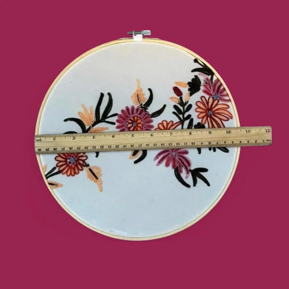 Set of two matching floral embroidered bamboo hoop art. 12” and 10.5”.